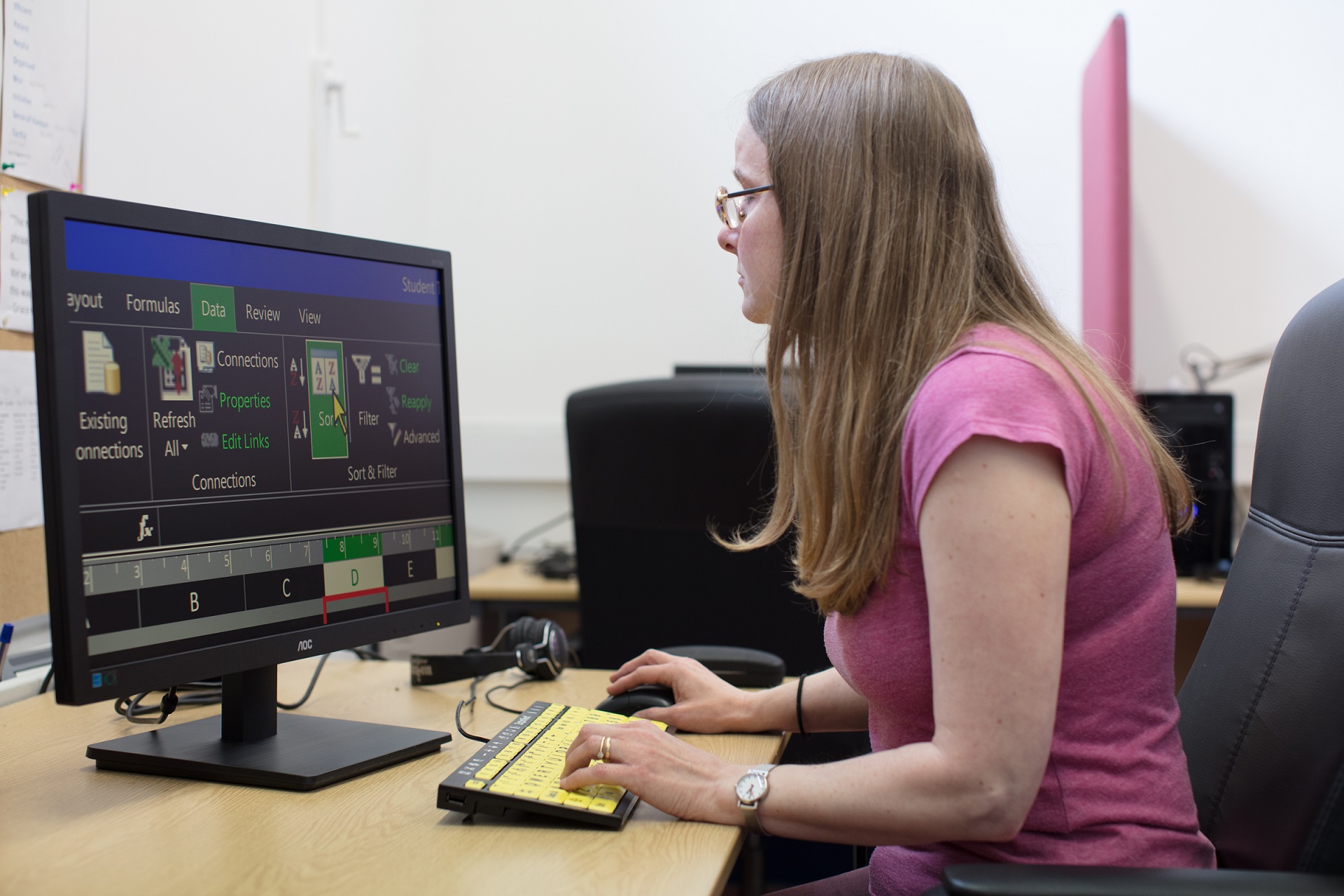 Woman at computer using screen magnification