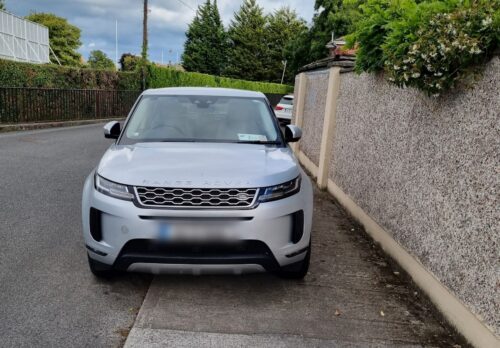 Car parked on footpath