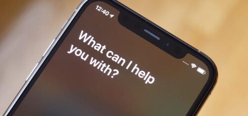 iPhone screen with Siri displaying message "What can I help you with?"