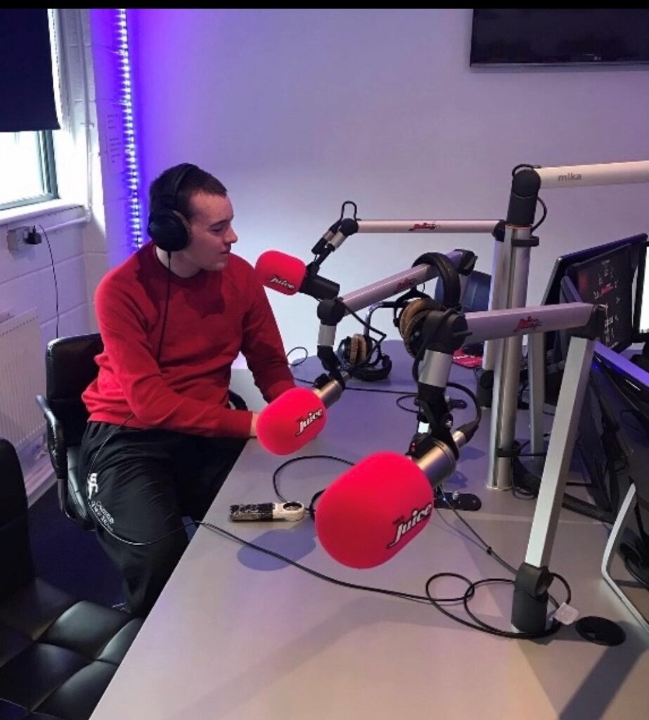 David Redmond following his passion and presenting in a radio studio