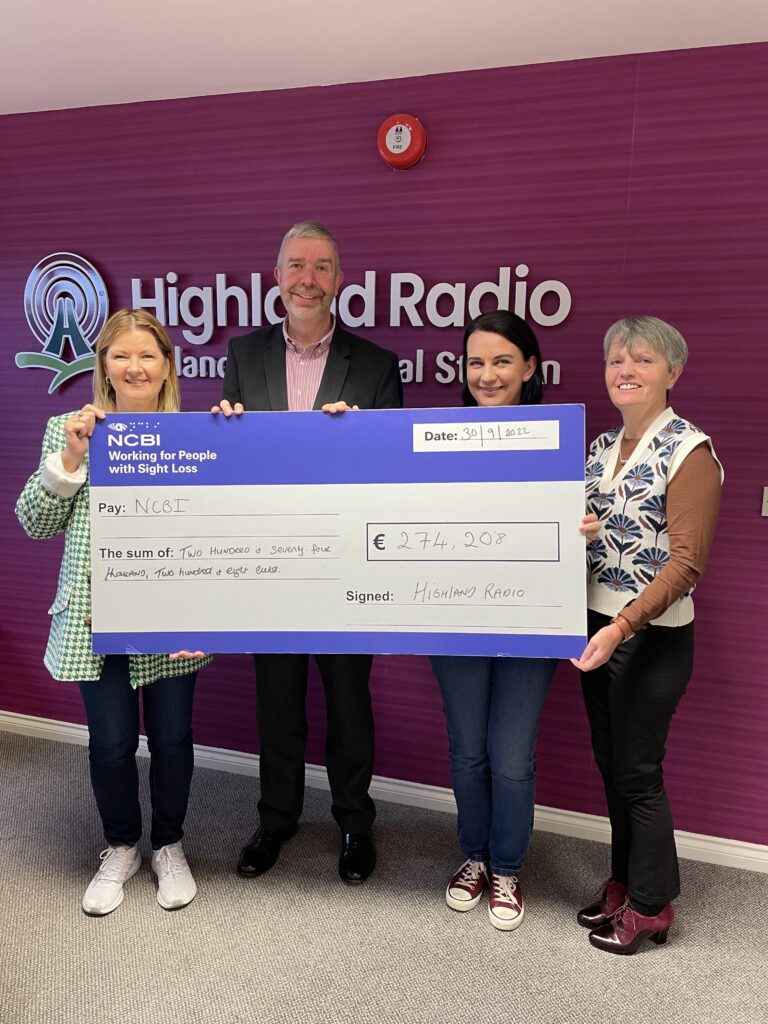Joanne McCarney, NCBI Fundraising Executive, and Danny Cahill, NCBI National Services Manager for the Adult Team, accept a cheque for NCBI for over €270,000 from the team at Highland Radio Bingo.