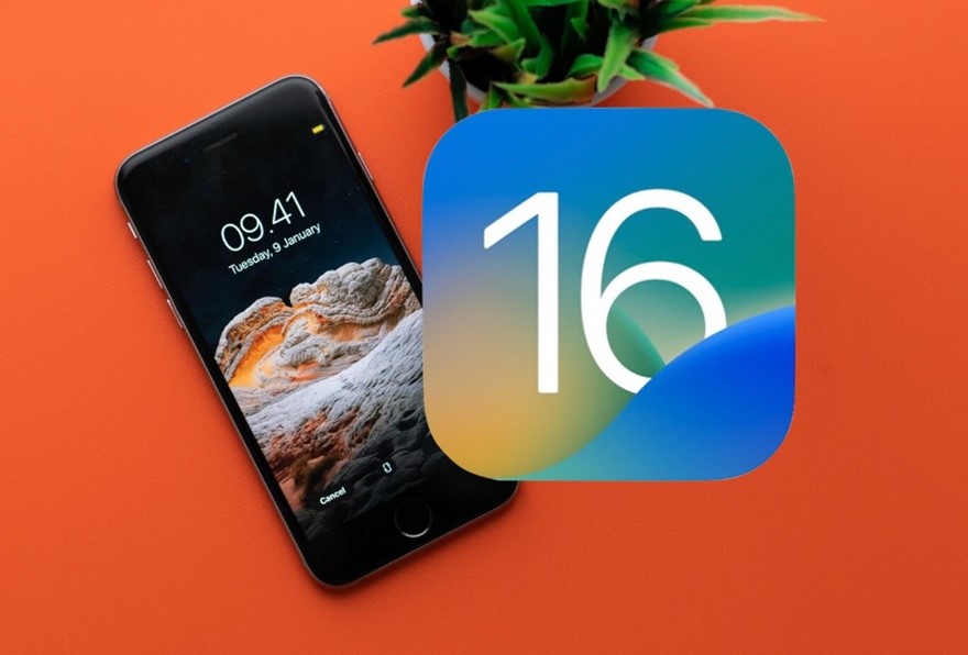 The number 16 set in front of an iPhone and orange background