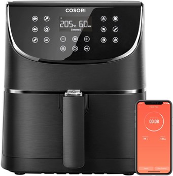 Cosori air-fryer in black next to smartphone