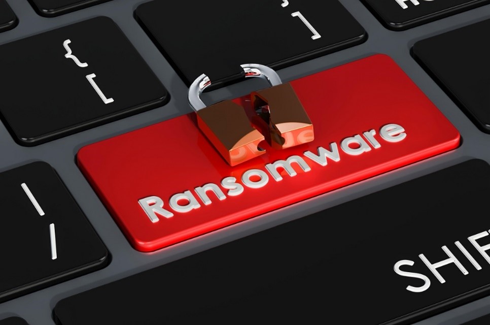 A broken lock on a computer keyboard above a key that reads 'Ransomware'